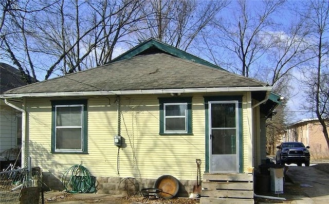 1909 S Broadway St, Pittsburg, KS 66762 - rear view of house with roof with shingles and entry steps