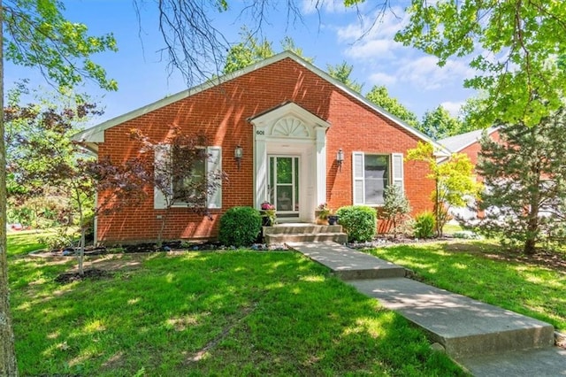 601 Darrow St, Warrensburg, MO 64093 - view of front facade with a front lawn and brick siding