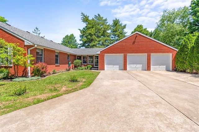 601 Darrow St, Warrensburg, MO 64093 - single story home featuring concrete driveway, an attached garage, brick siding, and a front yard