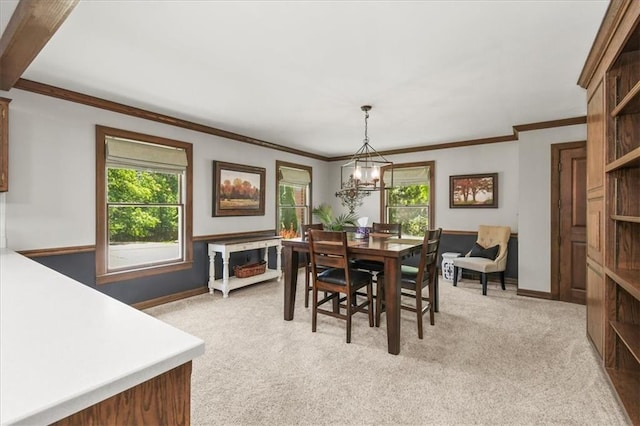 601 Darrow St, Warrensburg, MO 64093 - dining area featuring light carpet, crown molding, and a chandelier