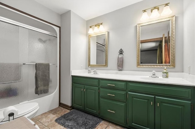 601 Darrow St, Warrensburg, MO 64093 - full bathroom featuring double vanity, tile patterned floors, and combined bath / shower with glass door