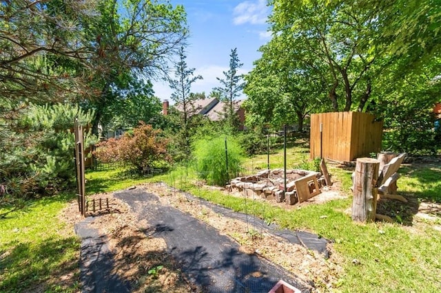 601 Darrow St, Warrensburg, MO 64093 - view of yard featuring a vegetable garden