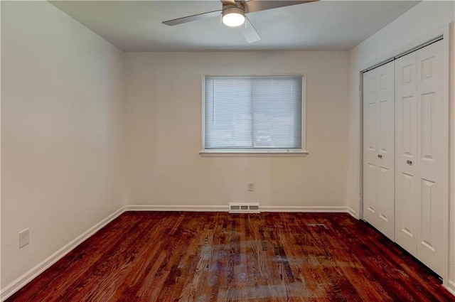 12825 E 50th Ter S, Independence, MO 64055 - unfurnished bedroom featuring wood finished floors, a closet, and a ceiling fan