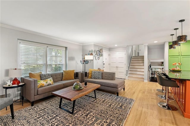 9934 Ballentine Dr, Overland Park, KS 66214 - living room with stairs, light wood-style floors, crown molding, and recessed lighting