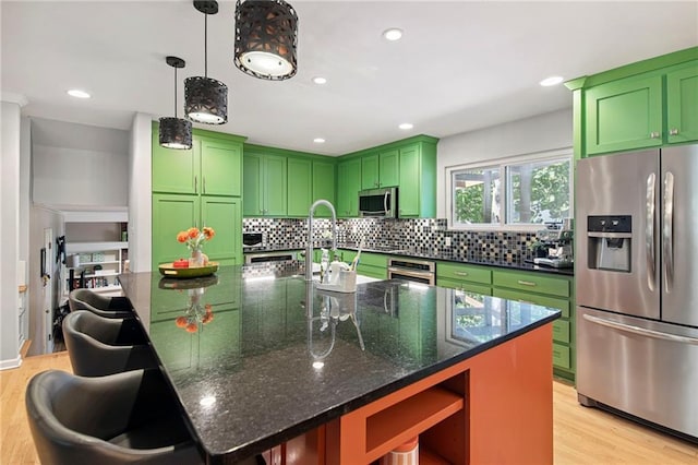 9934 Ballentine Dr, Overland Park, KS 66214 - kitchen with appliances with stainless steel finishes, green cabinets, open shelves, light wood-type flooring, and recessed lighting