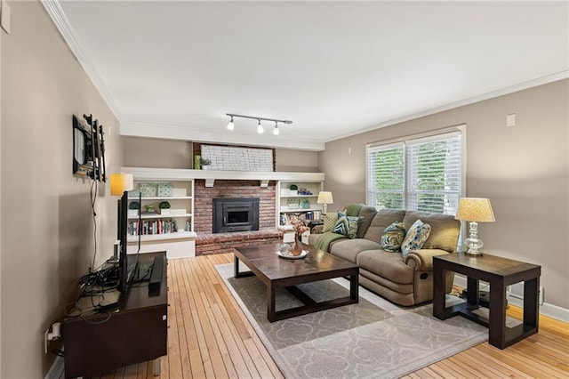 9934 Ballentine Dr, Overland Park, KS 66214 - living room with ornamental molding, wood-type flooring, and a brick fireplace