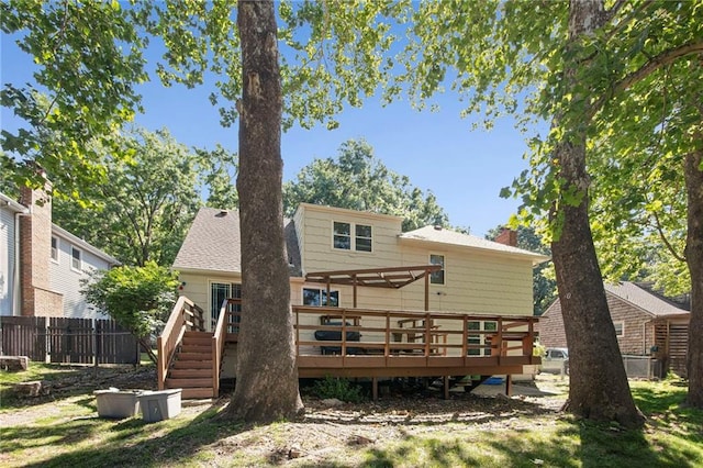 9934 Ballentine Dr, Overland Park, KS 66214 - back of house featuring a deck and a chimney