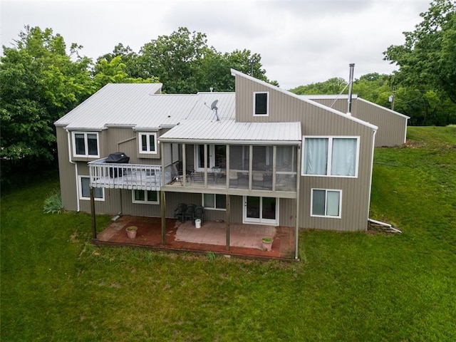 8231 Mike O Vince Rd, Ozawkie, KS 66070 - rear view of property with a deck, a lawn, and a metal roof