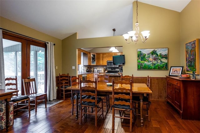 8231 Mike O Vince Rd, Ozawkie, KS 66070 - dining space with dark wood-style floors, a chandelier, and high vaulted ceiling
