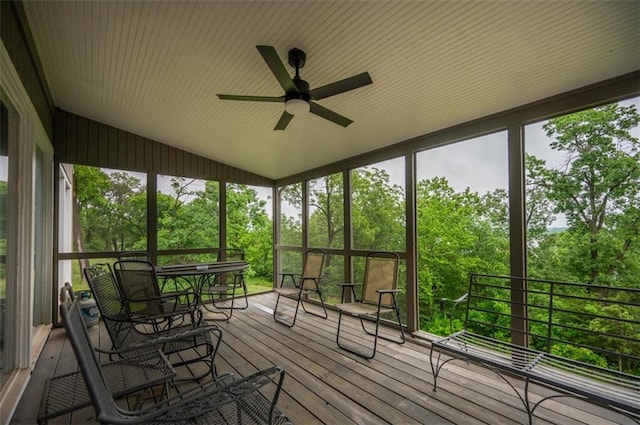 8231 Mike O Vince Rd, Ozawkie, KS 66070 - sunroom featuring a ceiling fan, plenty of natural light, vaulted ceiling, and view of wooded area