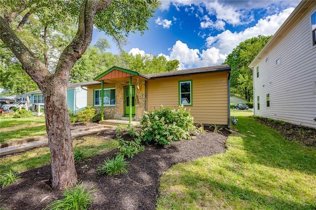 1504 Oak Hill Ave, Lawrence, KS 66044 - view of front of house featuring stone siding and a front yard