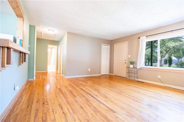 1504 Oak Hill Ave, Lawrence, KS 66044 - spare room with light wood finished floors and a textured ceiling