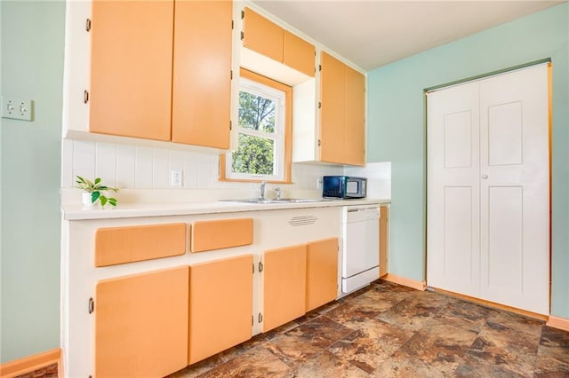 1504 Oak Hill Ave, Lawrence, KS 66044 - kitchen featuring white dishwasher, tasteful backsplash, light countertops, stone finish floors, and black microwave