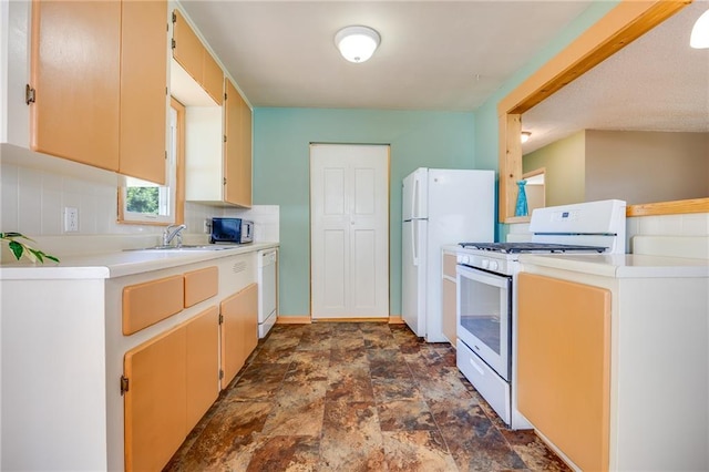 1504 Oak Hill Ave, Lawrence, KS 66044 - kitchen featuring white appliances, stone finish flooring, light countertops, and decorative backsplash