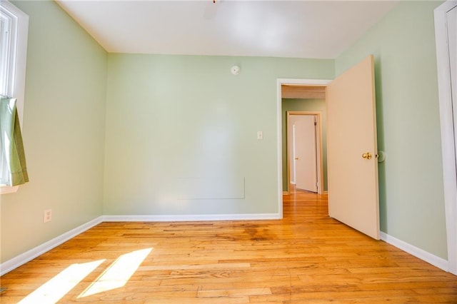 1504 Oak Hill Ave, Lawrence, KS 66044 - spare room featuring baseboards and light wood finished floors