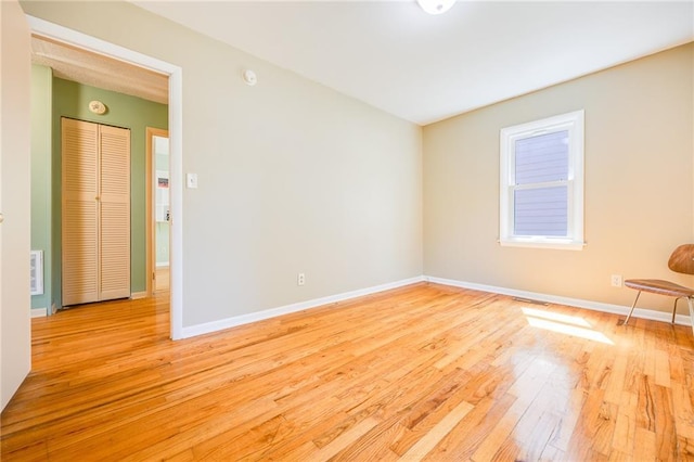 1504 Oak Hill Ave, Lawrence, KS 66044 - empty room with wood-type flooring and a smoke detector