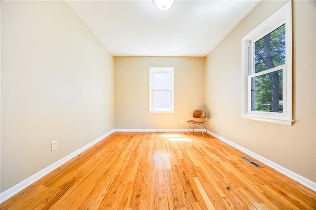 1504 Oak Hill Ave, Lawrence, KS 66044 - unfurnished room featuring plenty of natural light and wood finished floors