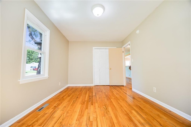 1504 Oak Hill Ave, Lawrence, KS 66044 - unfurnished bedroom featuring light wood-style floors and a closet