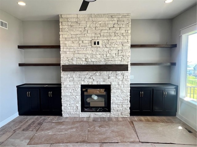 1709 SW Arbor Park Dr, Lees Summit, MO 64082 - unfurnished living room featuring a fireplace, wood finished floors, recessed lighting, and ceiling fan