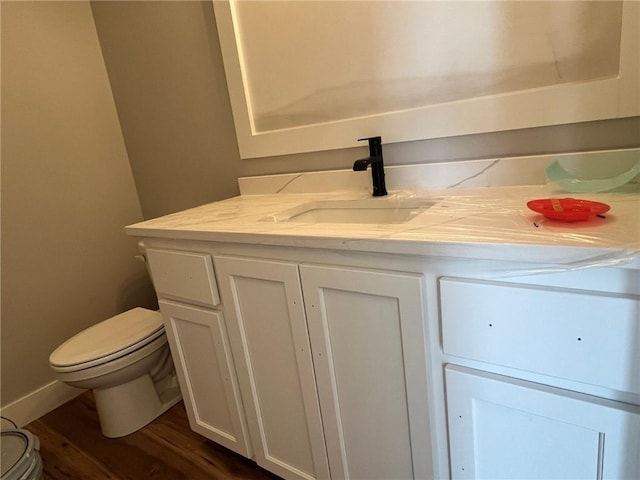 1709 SW Arbor Park Dr, Lees Summit, MO 64082 - half bathroom featuring wood finished floors and vanity