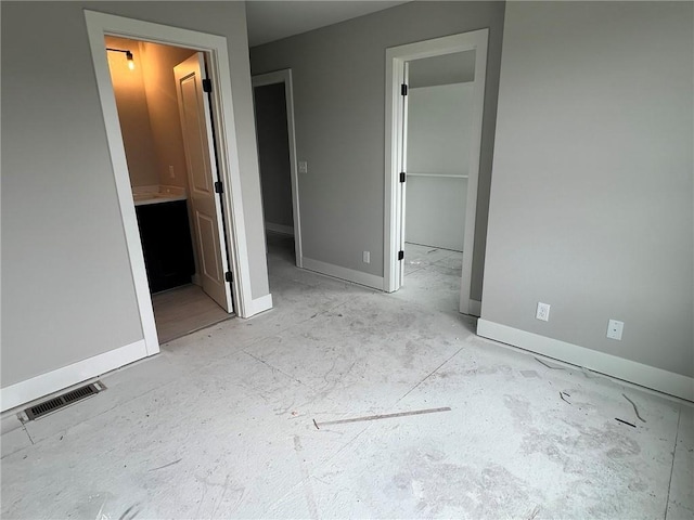 1709 SW Arbor Park Dr, Lees Summit, MO 64082 - unfurnished bedroom with a spacious closet, ensuite bath, and a closet