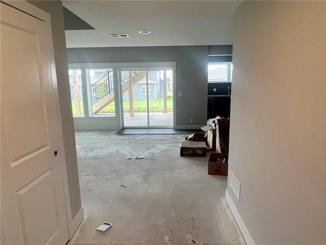 1709 SW Arbor Park Dr, Lees Summit, MO 64082 - corridor with unfinished concrete floors and healthy amount of natural light