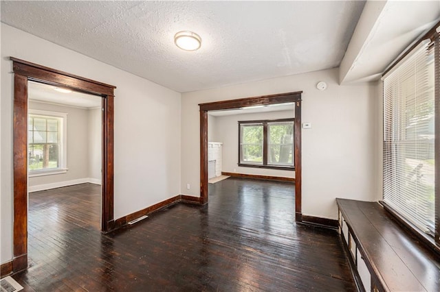3842 E 68th Ter, Kansas City, MO 64132 - corridor with hardwood / wood-style floors and a textured ceiling