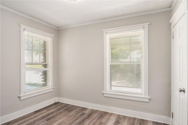 3842 E 68th Ter, Kansas City, MO 64132 - spare room featuring dark wood finished floors and ornamental molding
