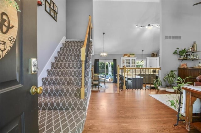 2125 SW Post Oak Rd, Lees Summit, MO 64082 - foyer with a high ceiling, wood finished floors, and stairs