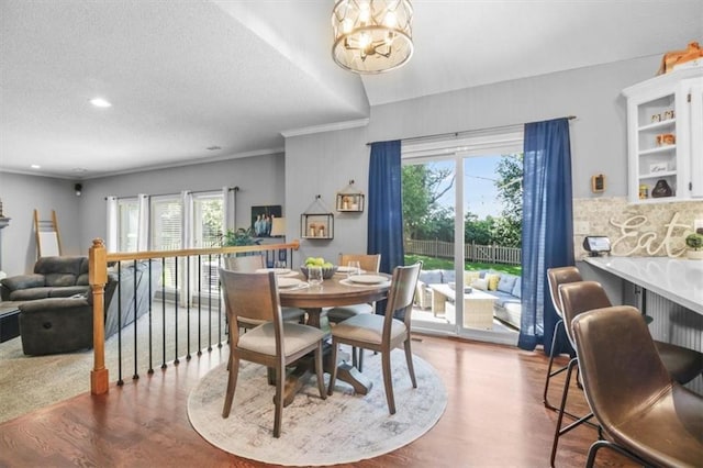 2125 SW Post Oak Rd, Lees Summit, MO 64082 - dining room featuring wood finished floors, a chandelier, a textured ceiling, and recessed lighting