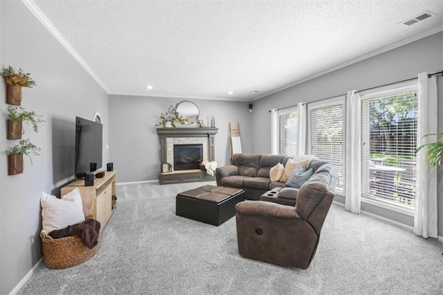 2125 SW Post Oak Rd, Lees Summit, MO 64082 - living area with a textured ceiling, carpet, ornamental molding, a glass covered fireplace, and recessed lighting