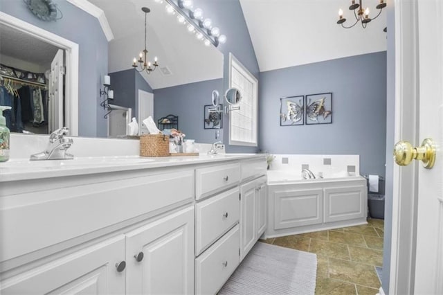 2125 SW Post Oak Rd, Lees Summit, MO 64082 - full bath featuring a chandelier, vaulted ceiling, double vanity, a bath, and a spacious closet