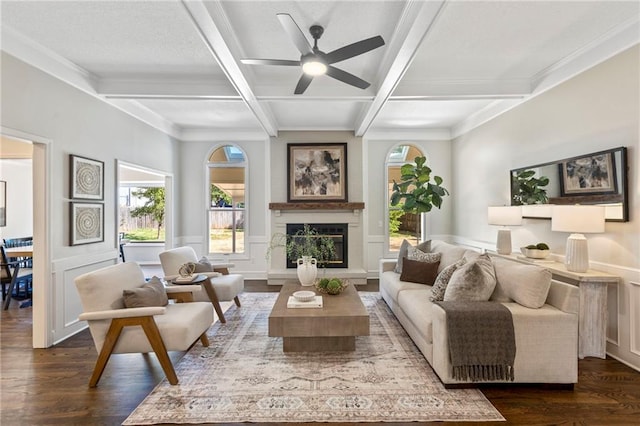 1424 E Meadow Ln, Olathe, KS 66062 - living room featuring coffered ceiling, dark wood finished floors, plenty of natural light, ceiling fan, and beam ceiling