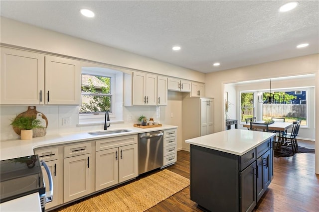 1424 E Meadow Ln, Olathe, KS 66062 - kitchen featuring dishwasher, electric range, light countertops, a textured ceiling, and dark wood-style floors