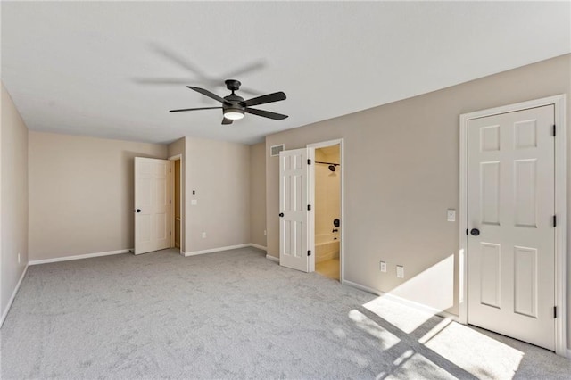 1424 E Meadow Ln, Olathe, KS 66062 - unfurnished bedroom featuring light colored carpet, ensuite bathroom, and ceiling fan