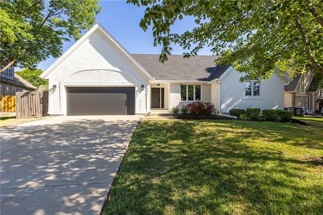 1424 E Meadow Ln, Olathe, KS 66062 - view of front of property with driveway, a garage, and stucco siding