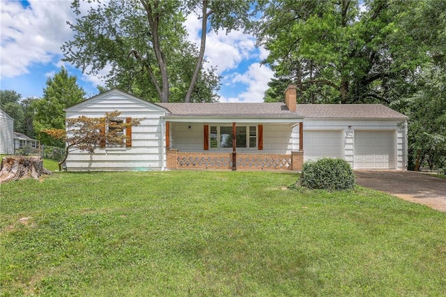 6605 Willow Ave, Raytown, MO 64133 - ranch-style home with a garage, concrete driveway, a front yard, a chimney, and covered porch