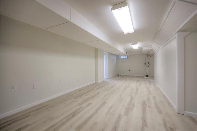 6605 Willow Ave, Raytown, MO 64133 - finished basement featuring light wood finished floors and baseboards