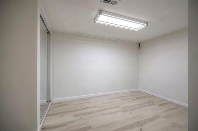 6605 Willow Ave, Raytown, MO 64133 - empty room with wood finished floors and baseboards