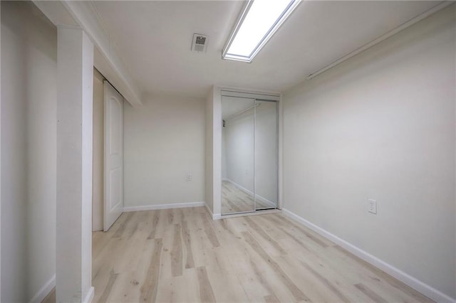 6605 Willow Ave, Raytown, MO 64133 - unfurnished bedroom with light wood-style floors and a closet