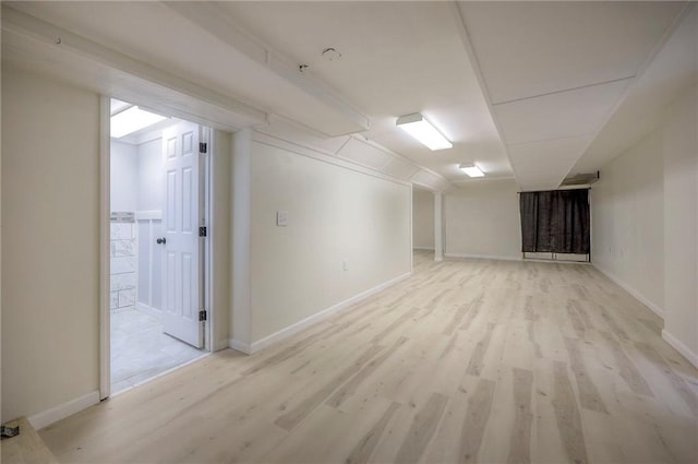 6605 Willow Ave, Raytown, MO 64133 - finished below grade area featuring light wood-type flooring and baseboards