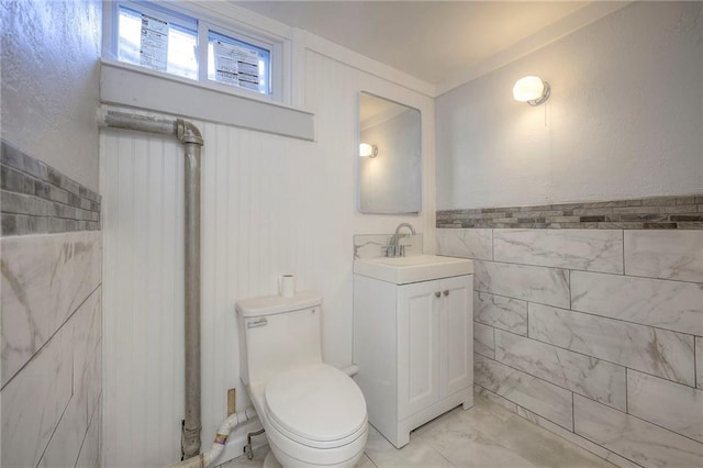 6605 Willow Ave, Raytown, MO 64133 - bathroom featuring vanity and tile walls