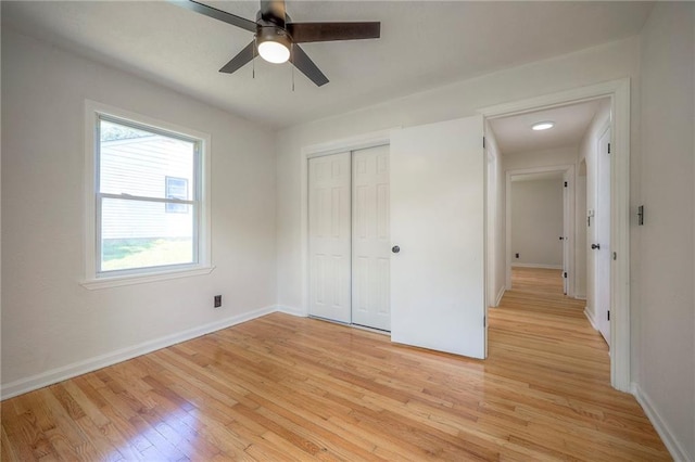 6605 Willow Ave, Raytown, MO 64133 - unfurnished bedroom featuring light wood-style floors, a closet, and a ceiling fan