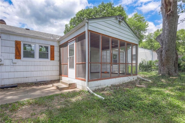 6605 Willow Ave, Raytown, MO 64133 - view of side of property featuring a sunroom