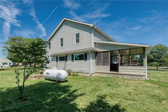 440 41p Rd, Clinton, MO 64735 - back of property featuring a sunroom and a yard