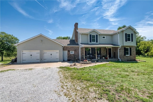 440 41p Rd, Clinton, MO 64735 - view of front of home featuring a porch, driveway, a chimney, a front lawn, and a garage
