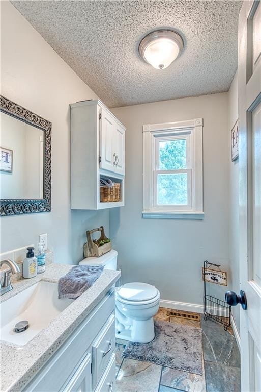 440 41p Rd, Clinton, MO 64735 - bathroom featuring vanity and a textured ceiling