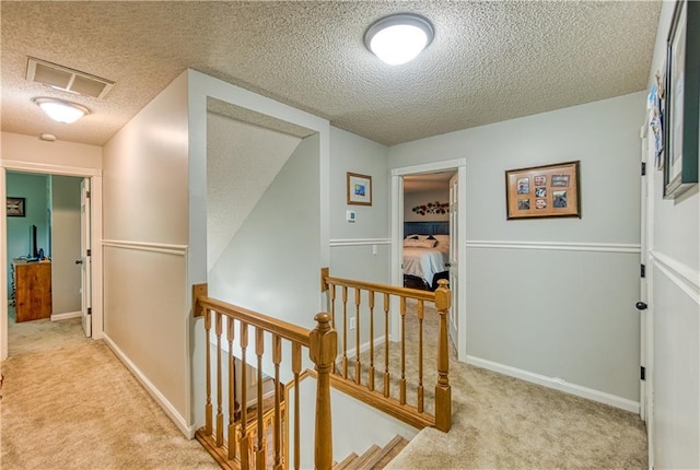 440 41p Rd, Clinton, MO 64735 - hall with an upstairs landing, a textured ceiling, and carpet floors
