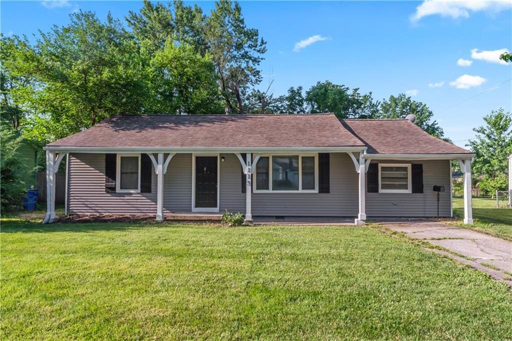 1113 E Cedar St, Olathe, KS 66061 - ranch-style home featuring a front lawn and covered porch