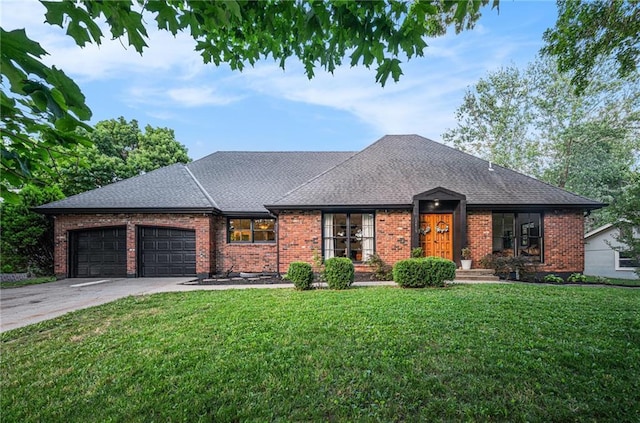 12419 Askew Dr, Grandview, MO 64030 - view of front facade with roof with shingles, an attached garage, and brick siding